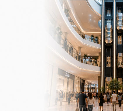 Modern shopping mall interior with glass elevators and shoppers in Egypt
