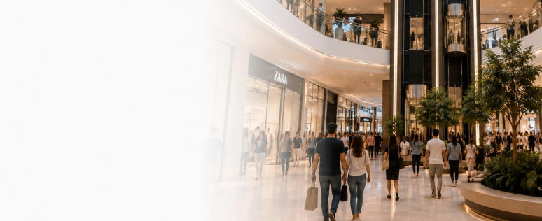 Modern shopping mall interior with glass elevators and shoppers in Egypt